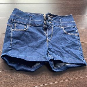 Three button dark wash denim shorts.